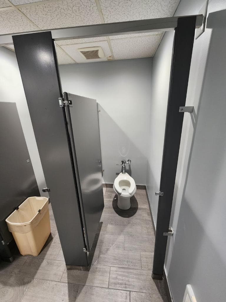 Finished commercial bathroom stall area after renovation in Allentown.