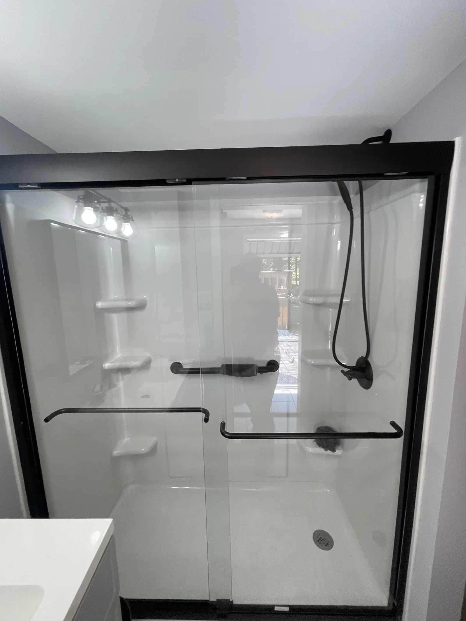 Shower fixtures and trim detail.