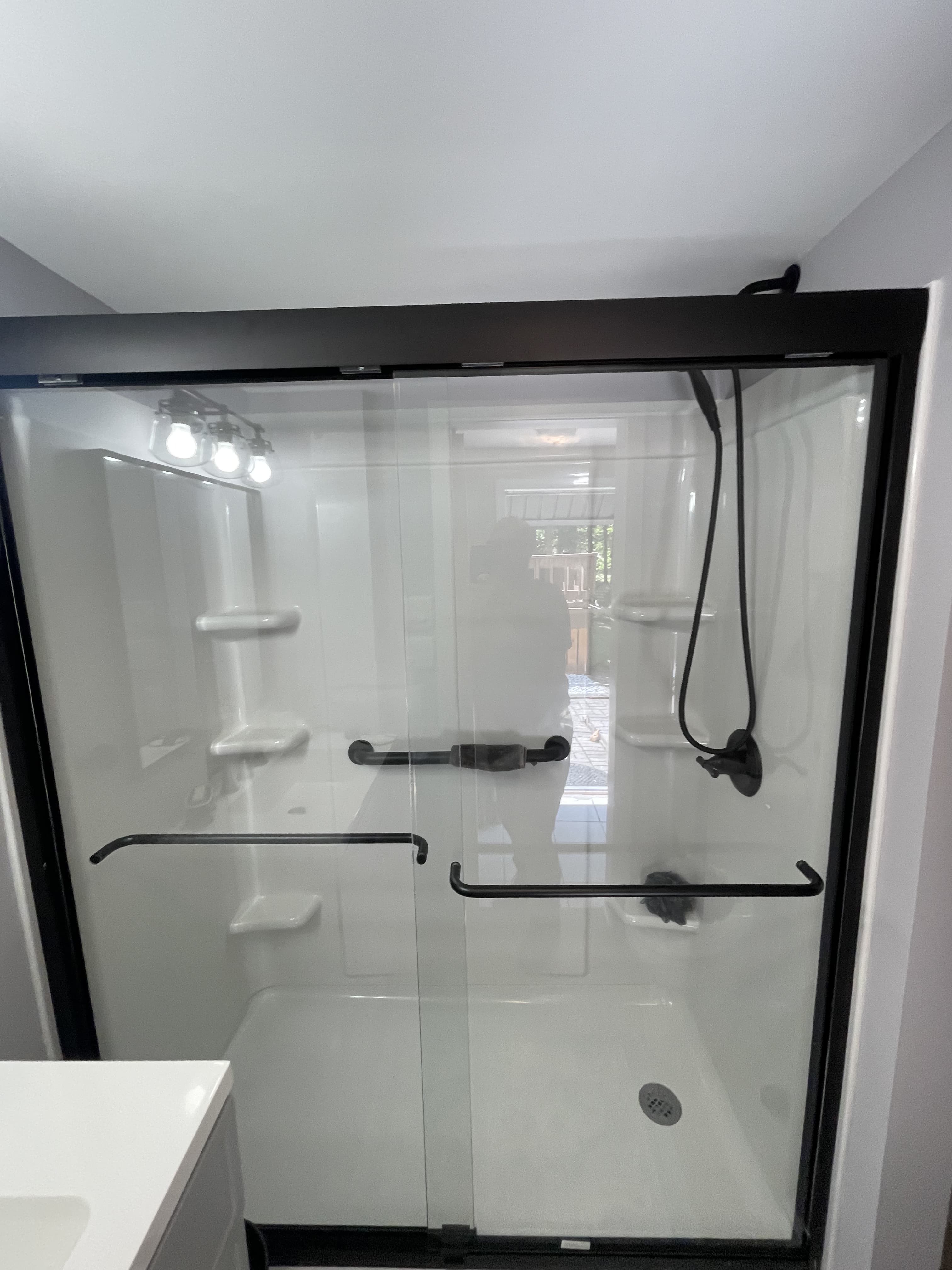 Close-up of finished shower enclosure and fixtures