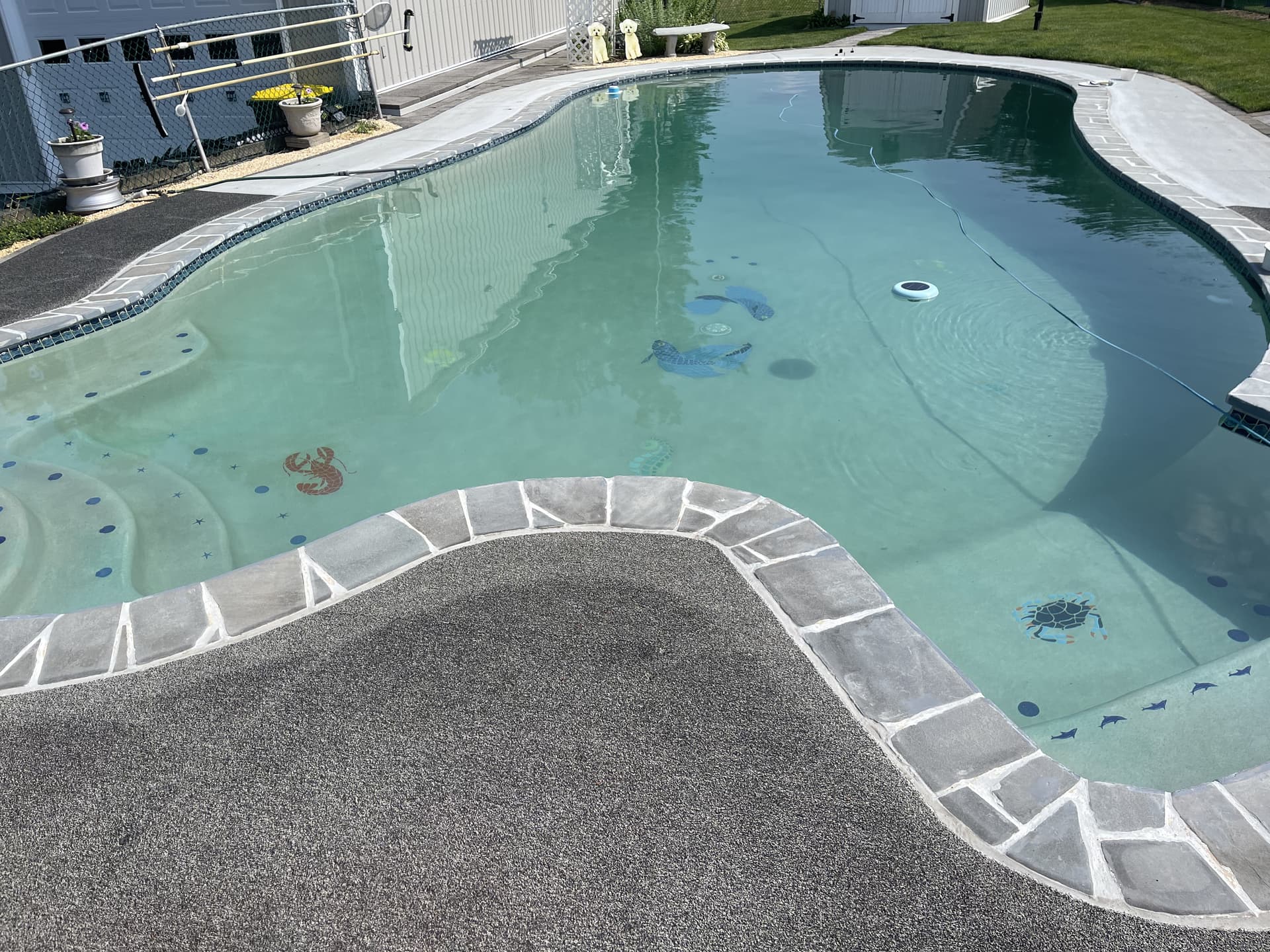 Finished pool patio: wide view of new hardscape and pool surround in Bethlehem.