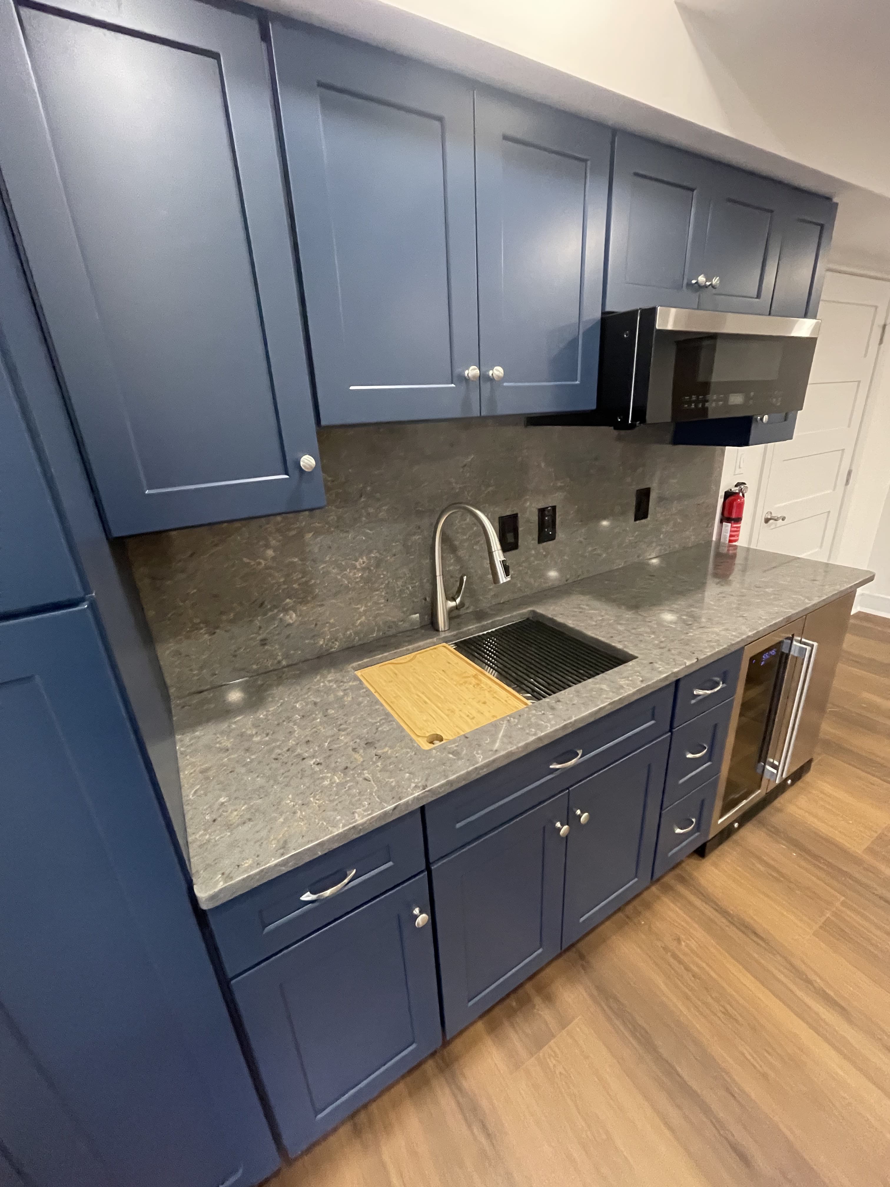 Kitchen cabinets and counters complete after installation.