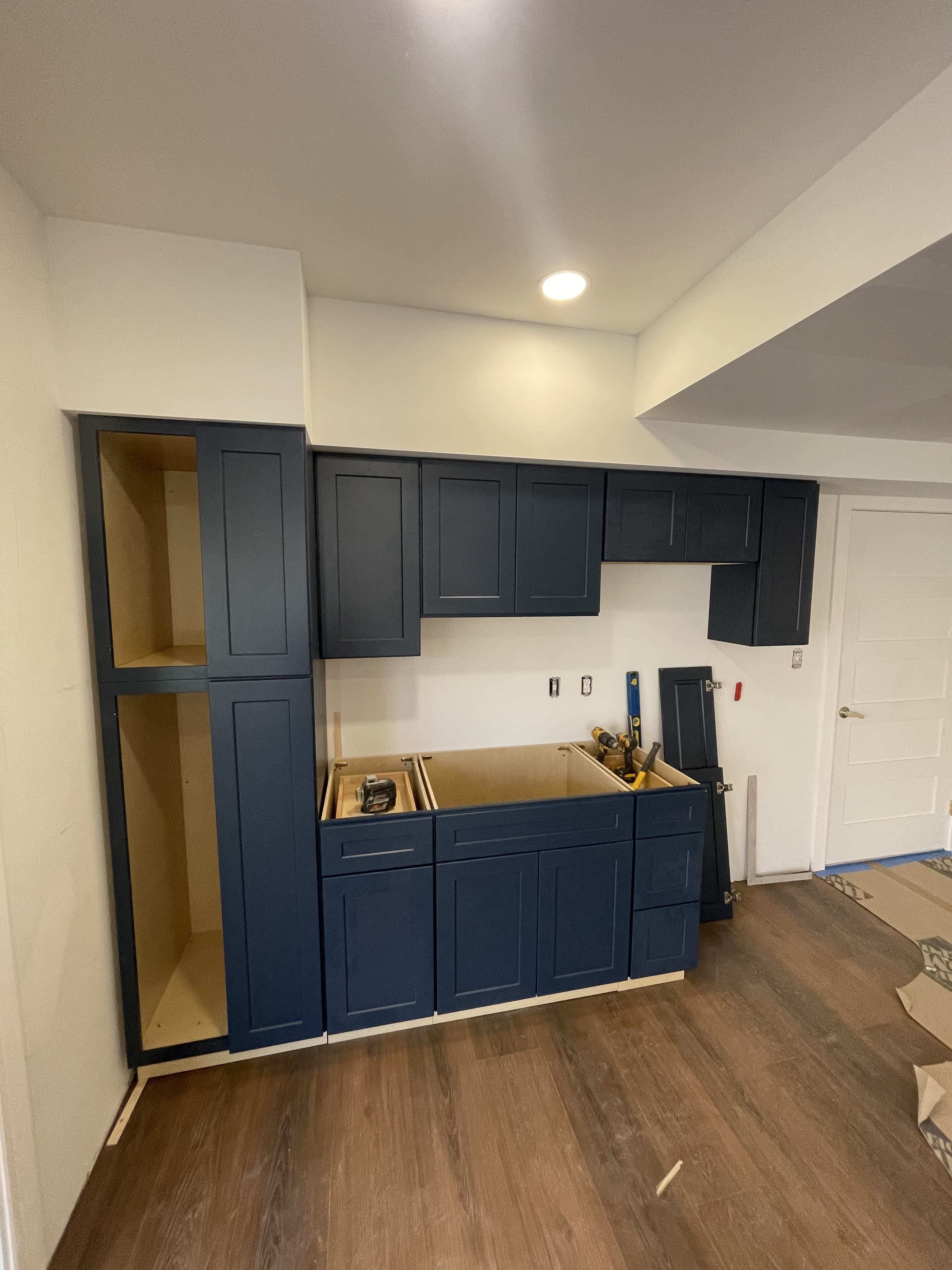 Kitchen cabinets during installation and alignment.