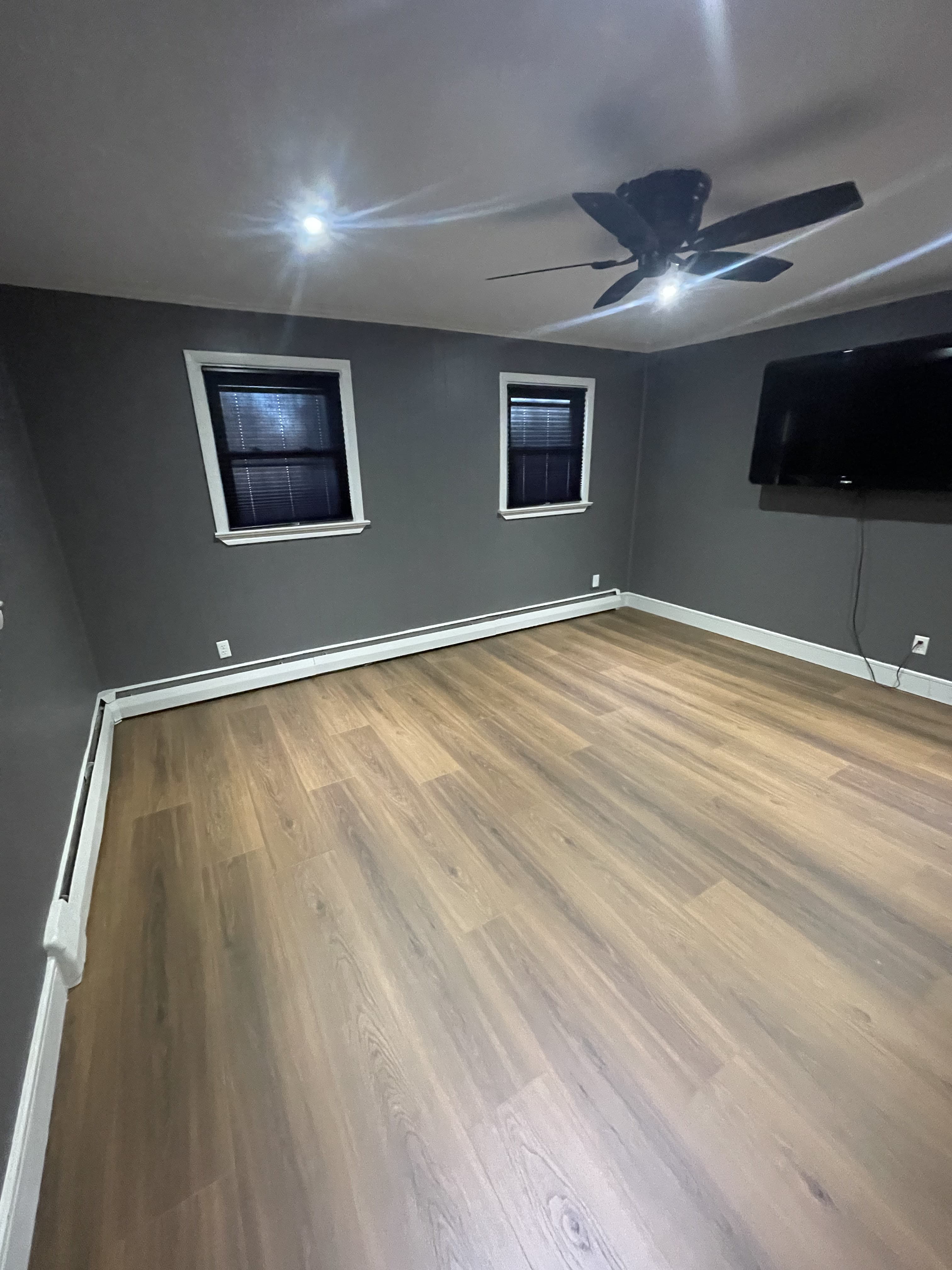 Alternate angle of refreshed bedroom with blue wall color.