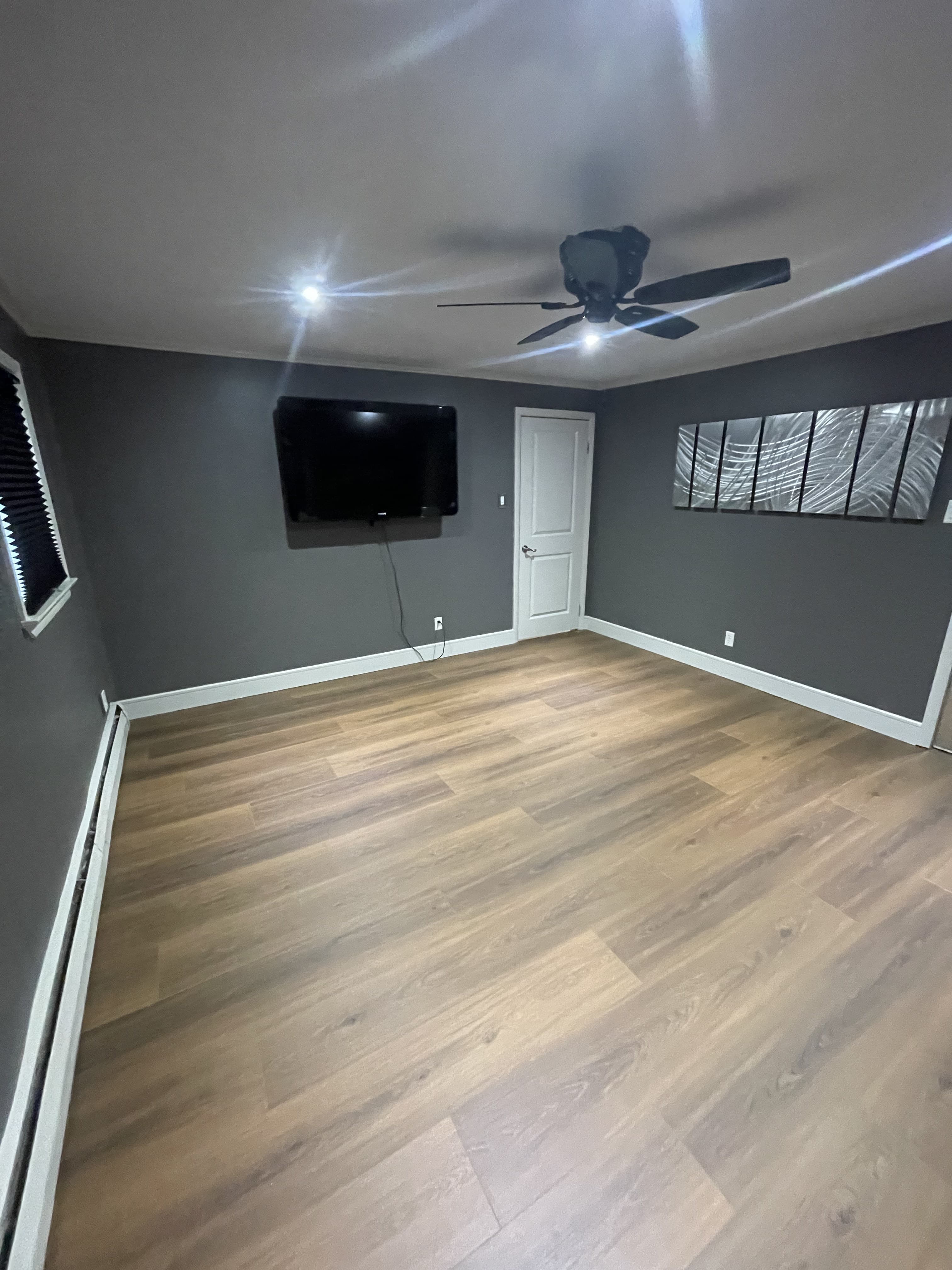 Bedroom interior with updated blue walls and coordinated finishes.