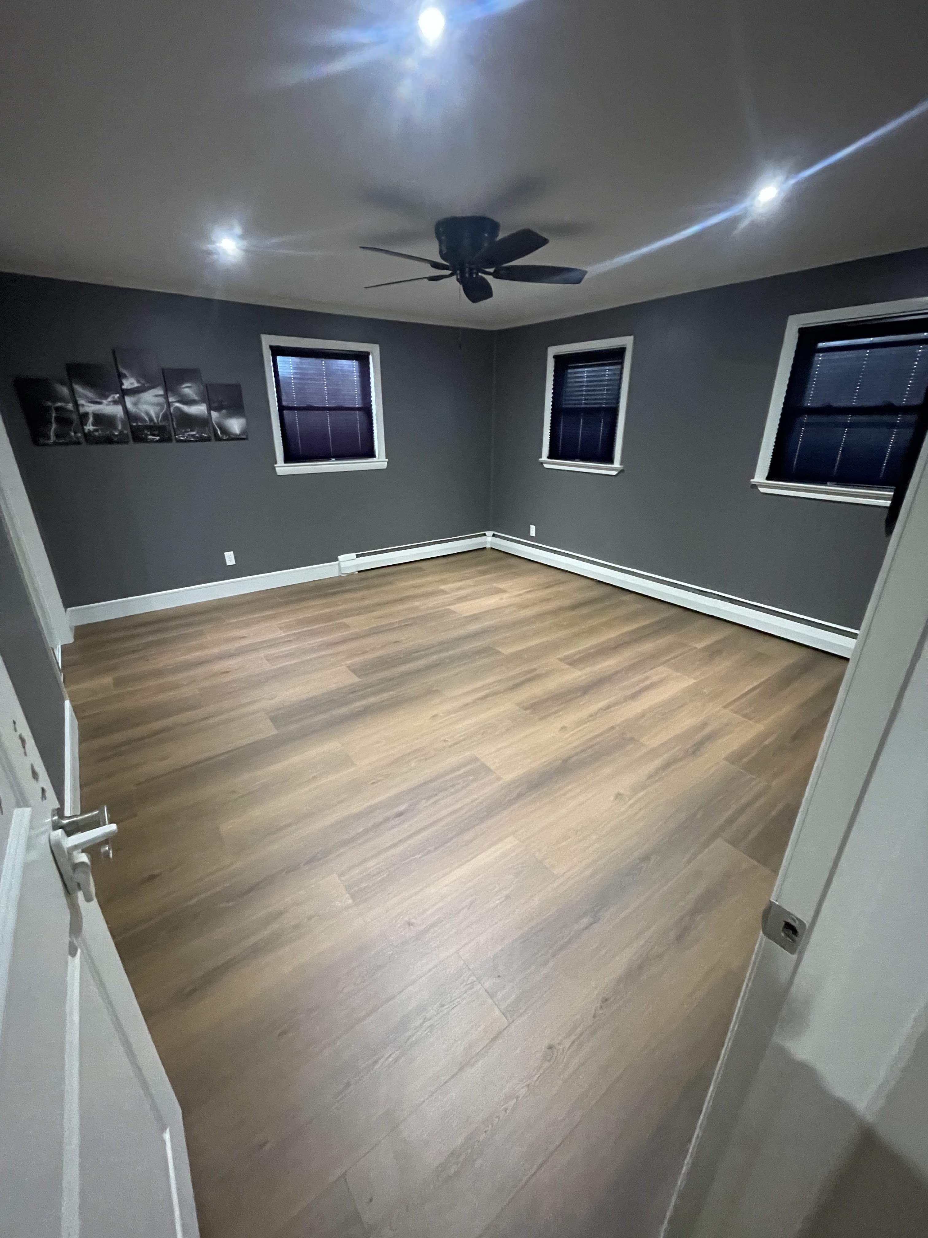 Wide view of refreshed bedroom interior after completion.